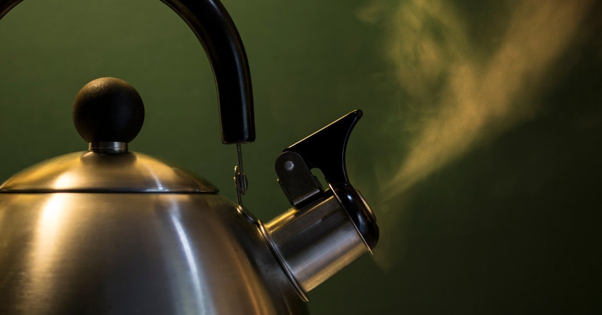 photo of a teapot that is boiling water