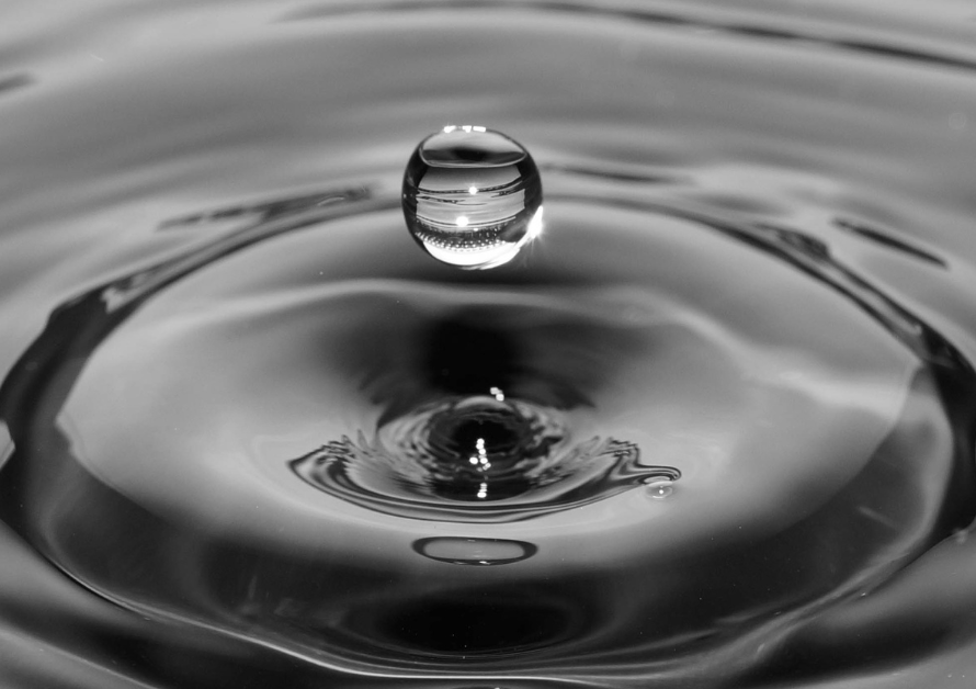 photo of a waterdrop hitting the water