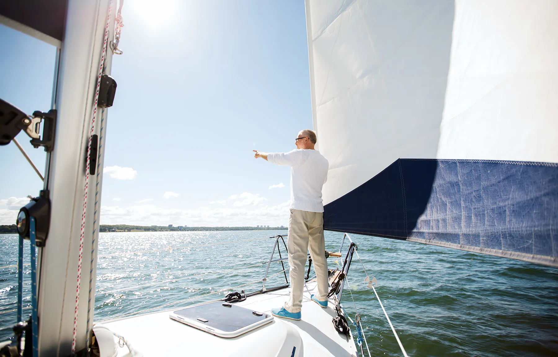 Sailing, Age, Tourism, Travel And People Concept - Senior Man On Sail Boat Or Yacht Floating In Sea