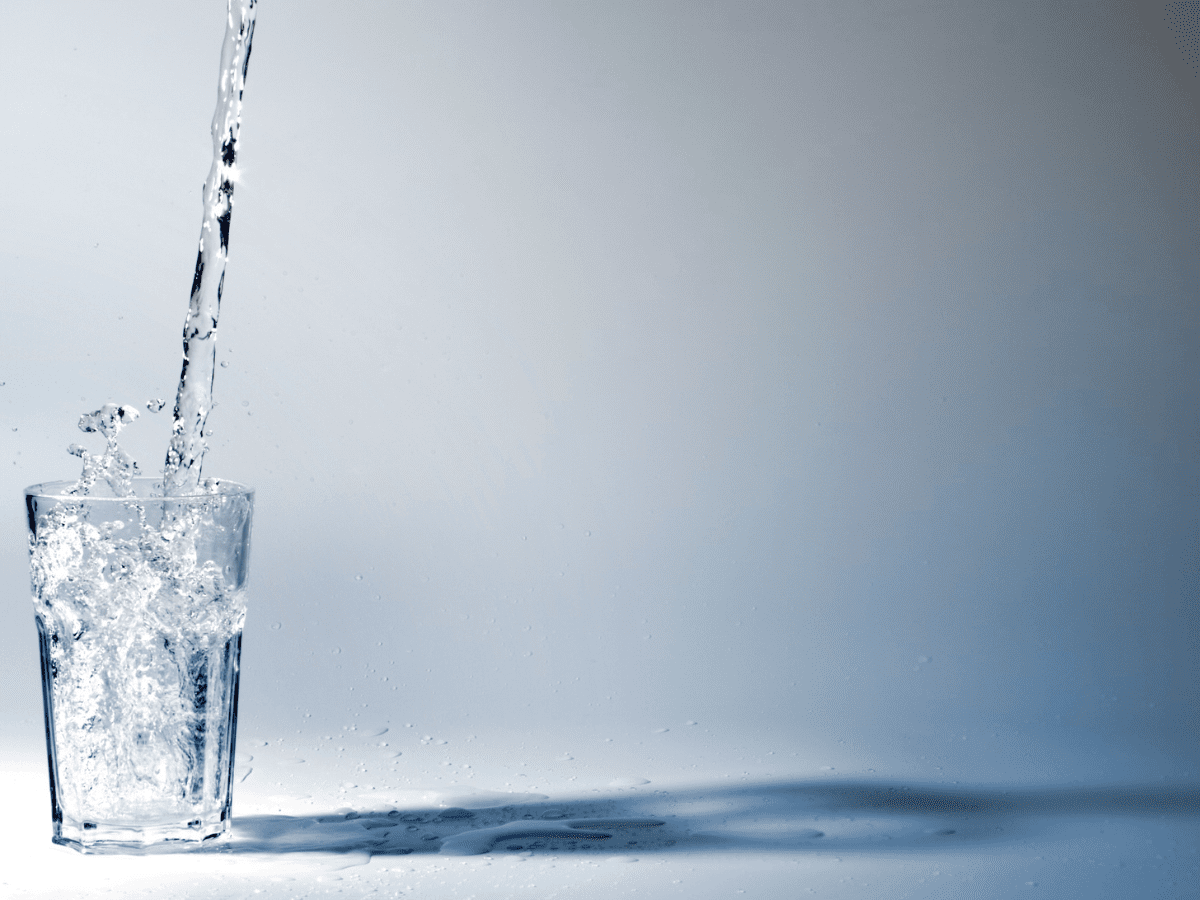 photo of water going into a glass
