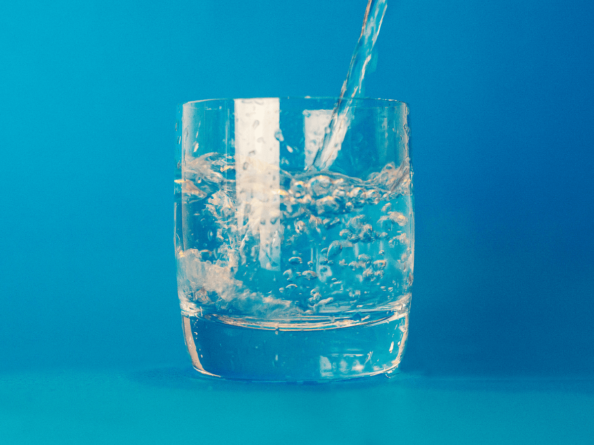 fresh water being poured into a glass
