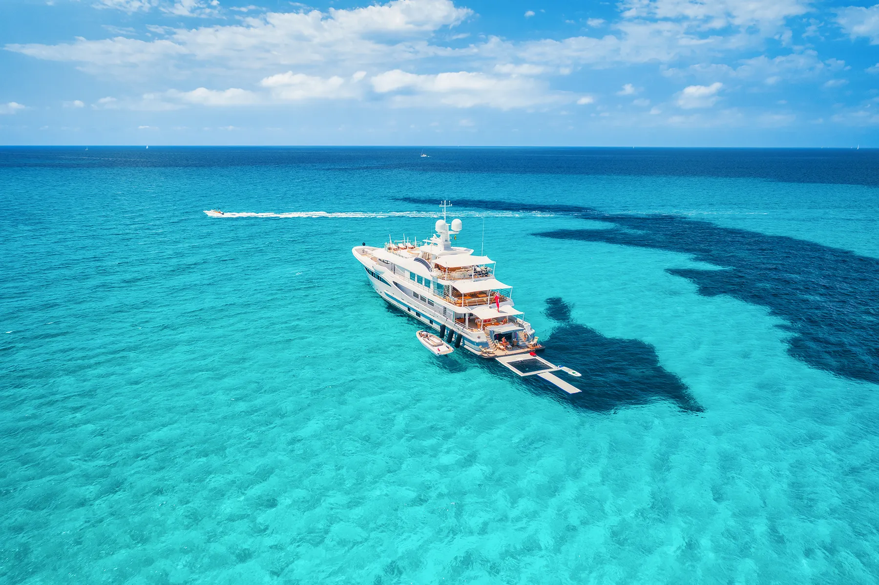 Yacht on the azure seashore in balearic islands