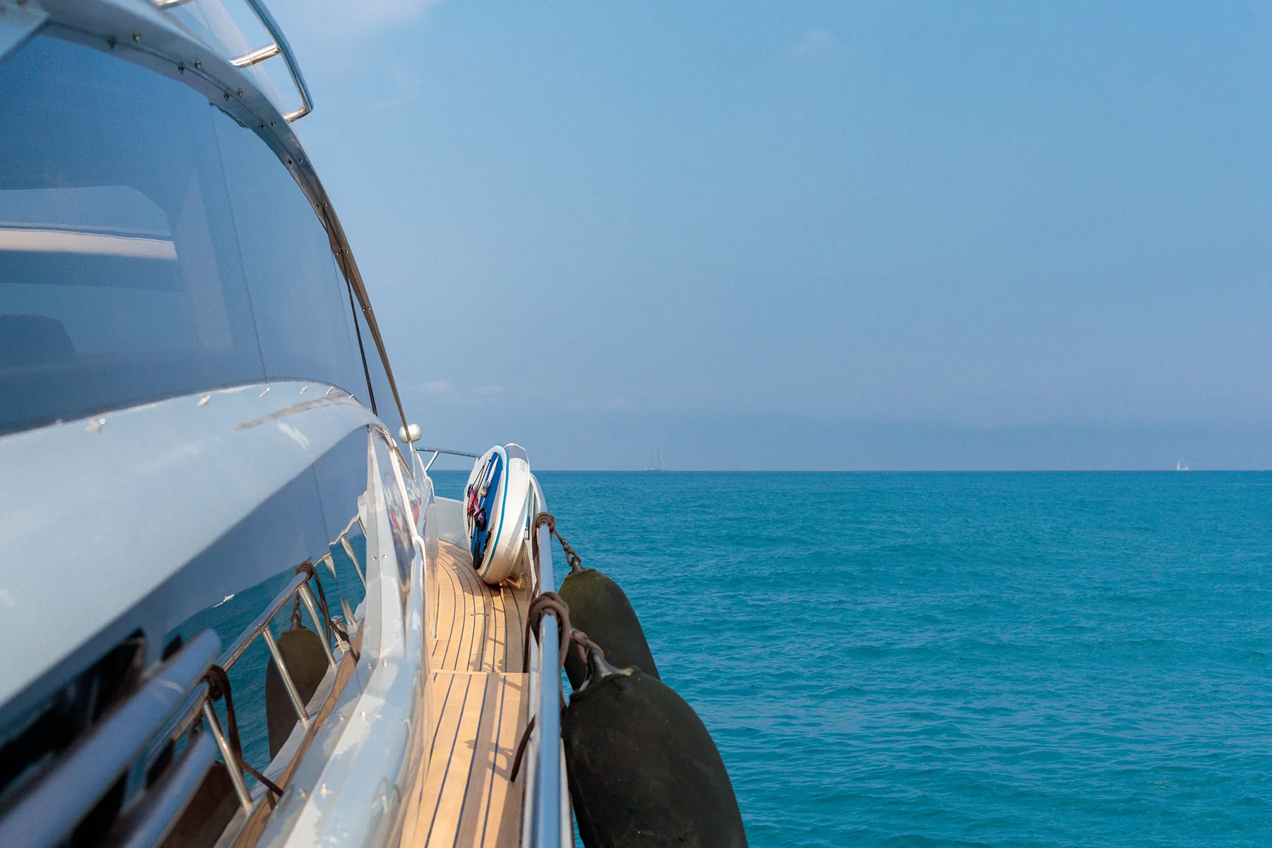 Beautiful shot from the yacht of the sea with a blue sky in the background
