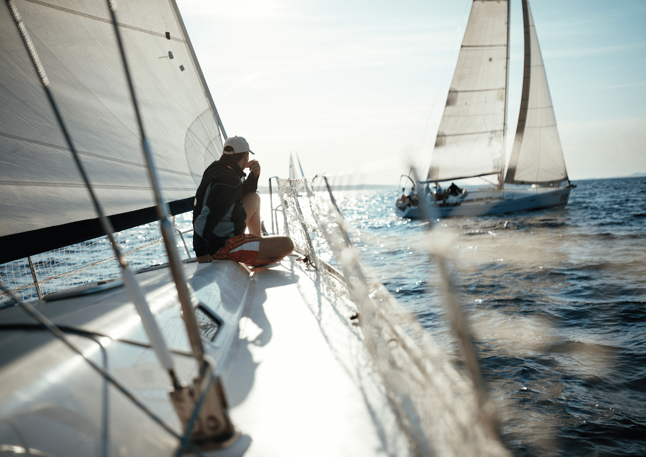 man sitting on a sailboat