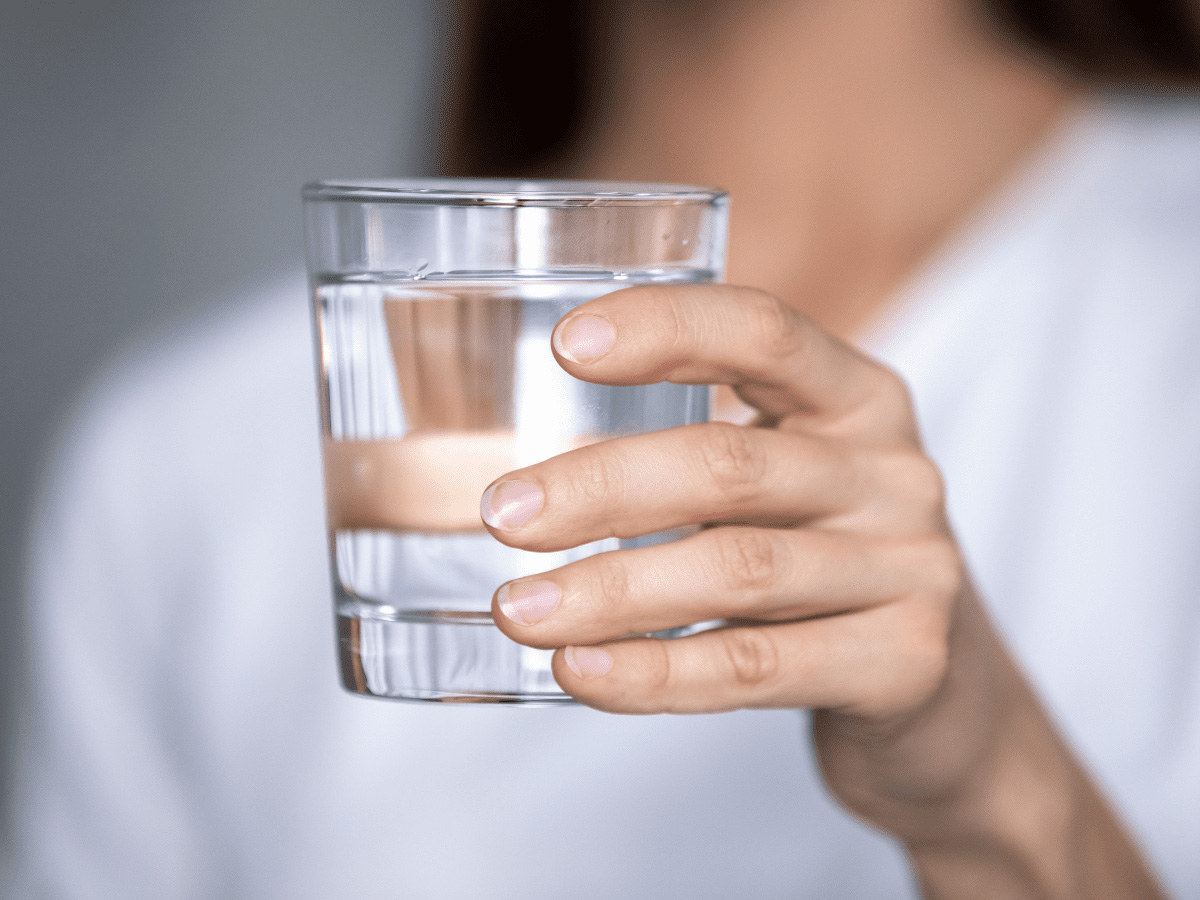 A Hand Holding a Glass