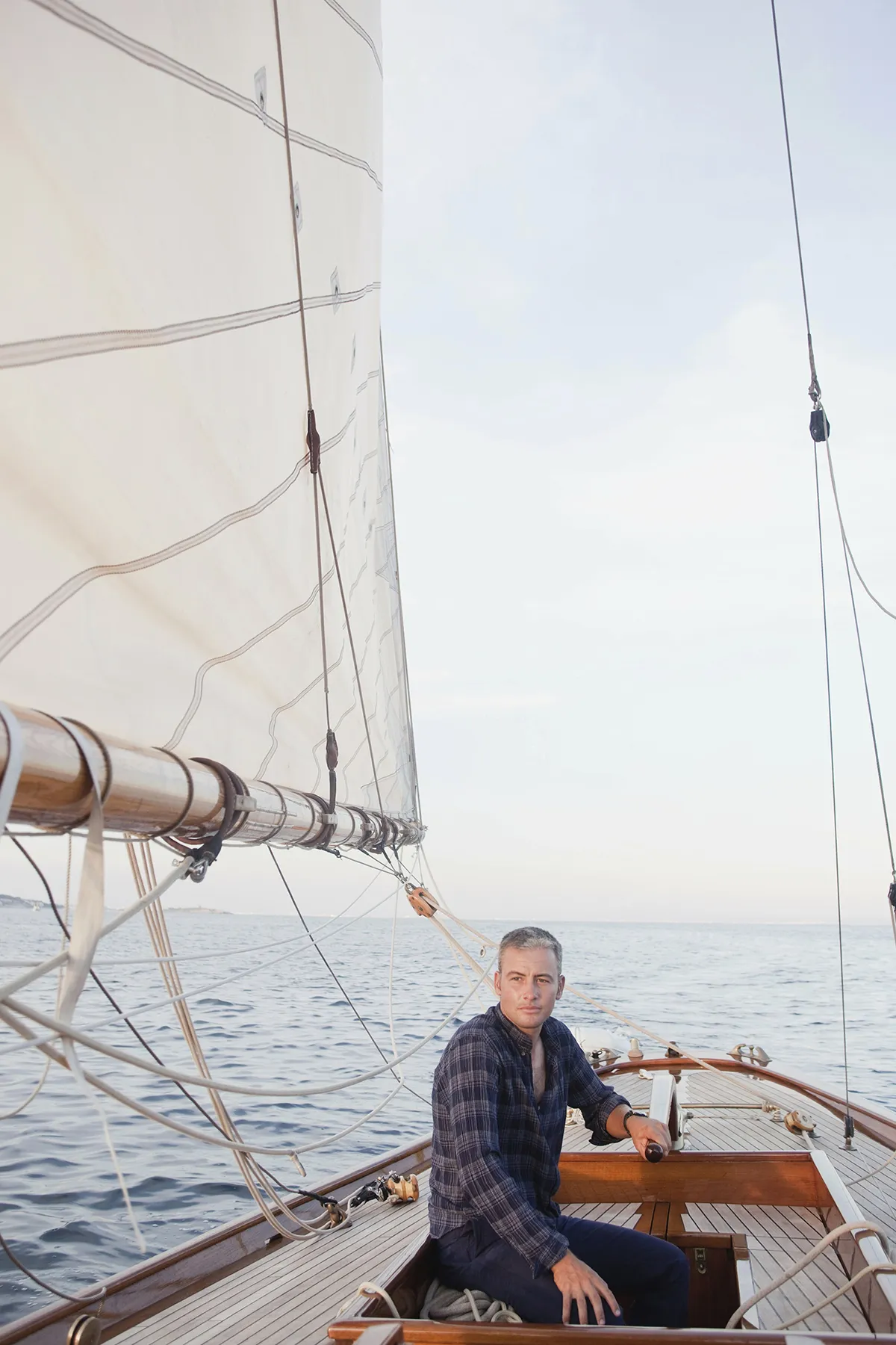 man steering a sailing boat