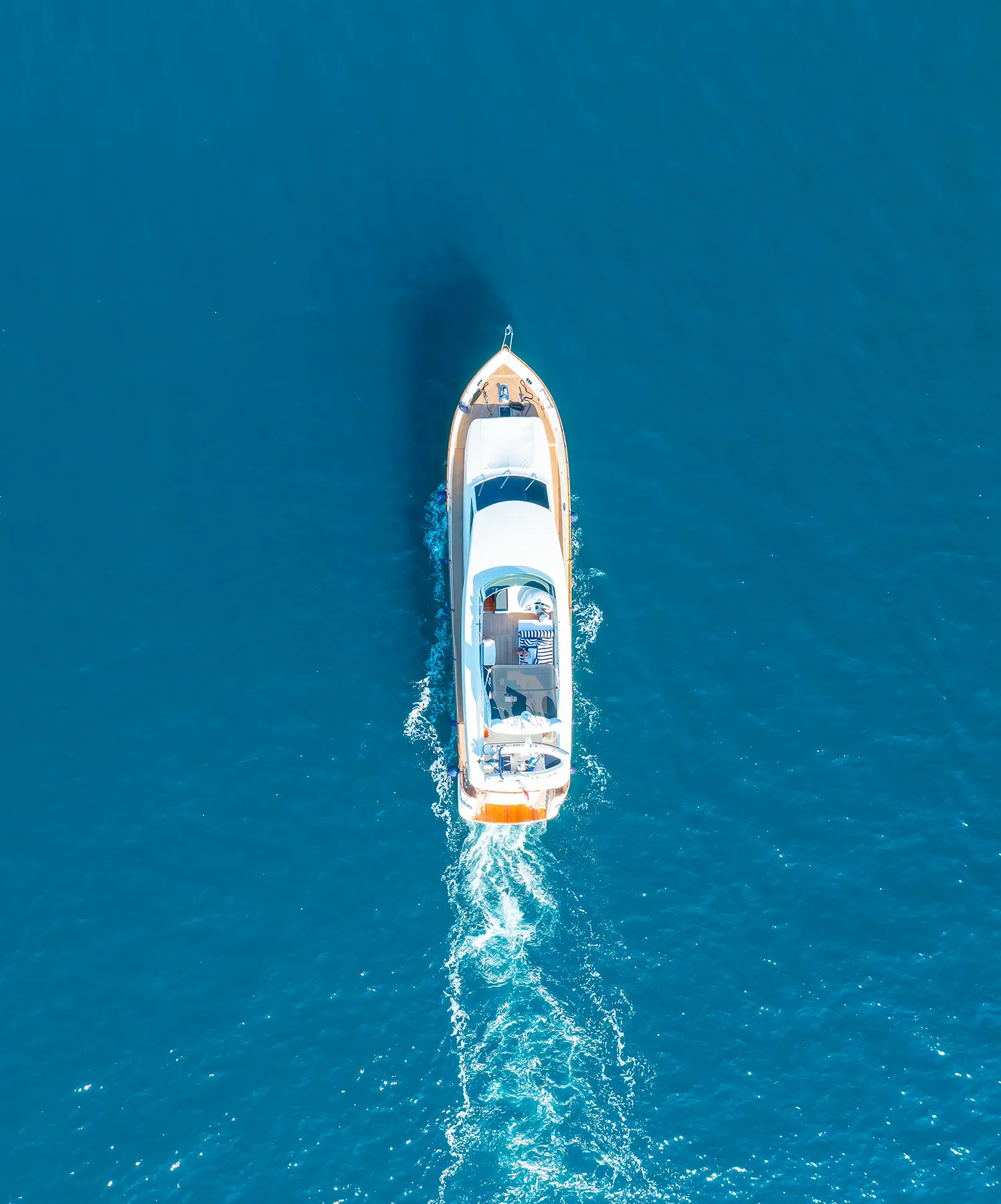 seafoam trail left by luxury yacht sailing
